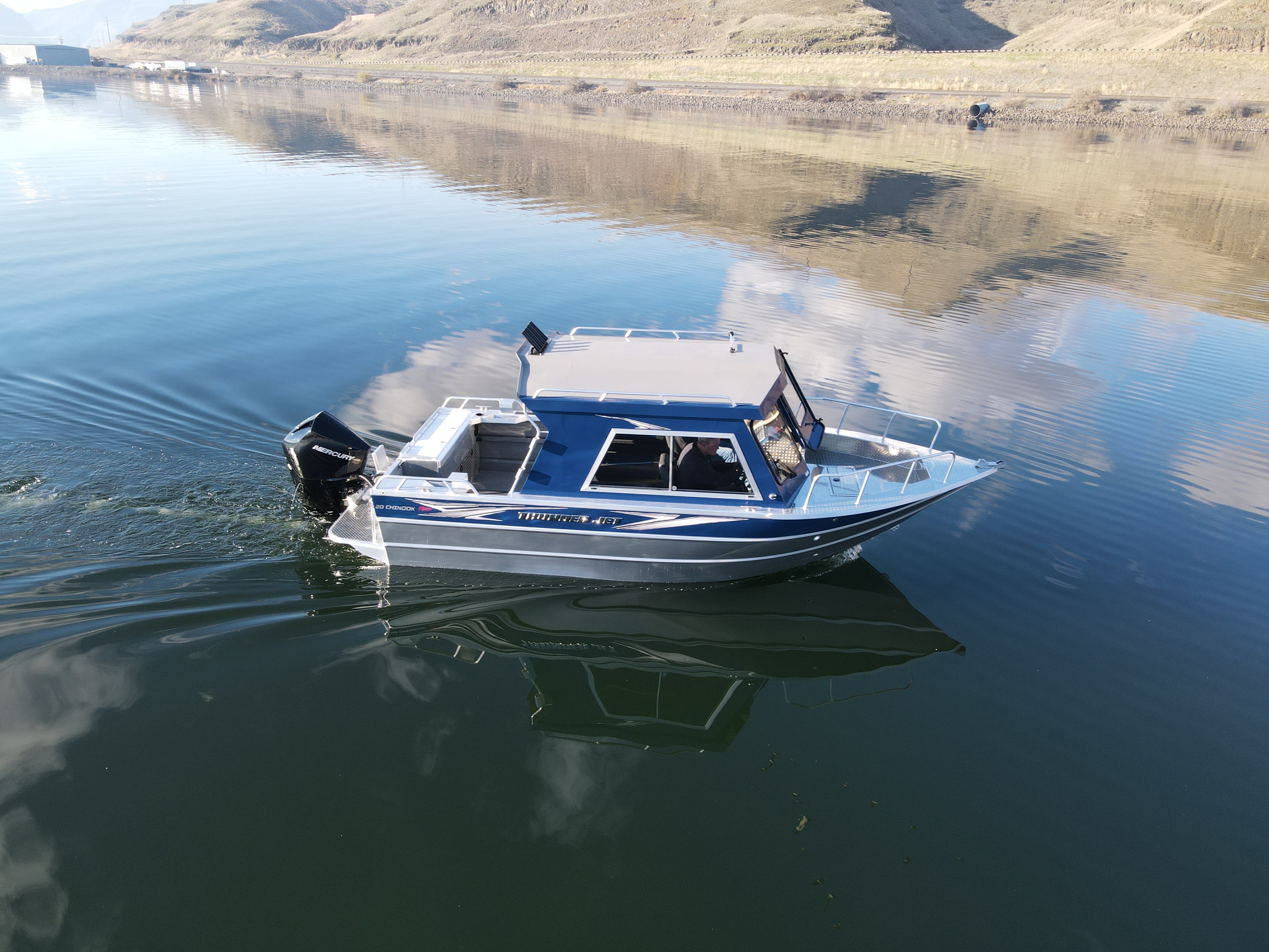 A Blue Plastic Fishing Boat with a Bench that Stands on Supports